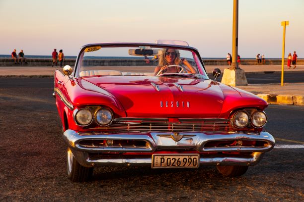 Amelia in classic car in Havana, Cuba